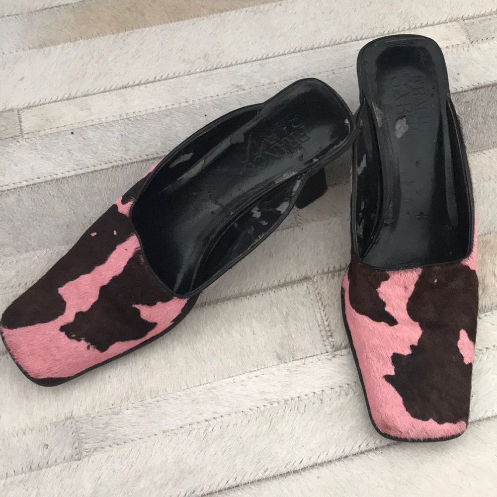 Cow print mules with slight heel